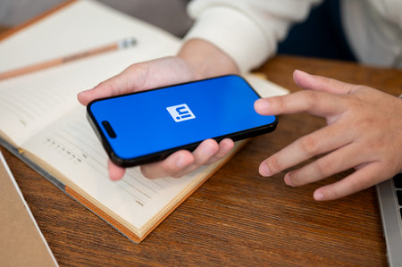 Chiang Mai, Thailand - Oct 18 2023: Close-up image of a woman using LinkedIn application on her...
