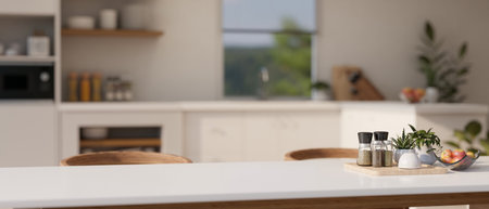 Copy space for displaying your product on a white dining table in a modern white kitchen with...