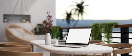 A white-screen laptop computer on a table on a beautiful home balcony. Home workspace, close-up image. 3d render, 3d illustrationの写真素材