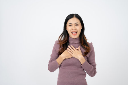 Happy cheerful young businesswoman excited for the good news. white isolated background.の写真素材