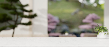 A white marble tabletop with copy space for display product with a blurred background of a minimal...