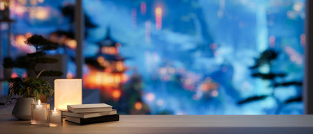 A space for displaying products on a tabletop features books, a table lamp, candles, and a potted...
