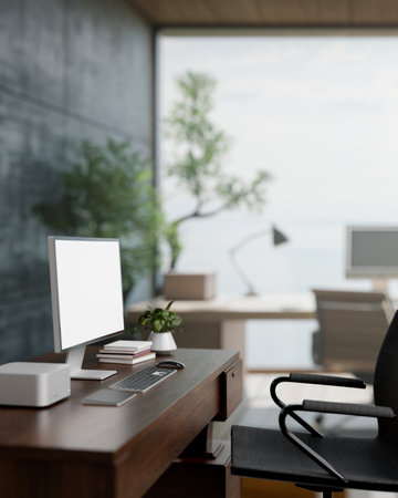 A side view image of a computer on a hardwood desk in a contemporary loft office. workspace interior...
