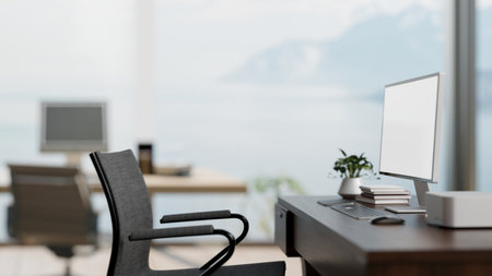 A side view image of a computer desk in a modern bright office with an amazing large window with a...