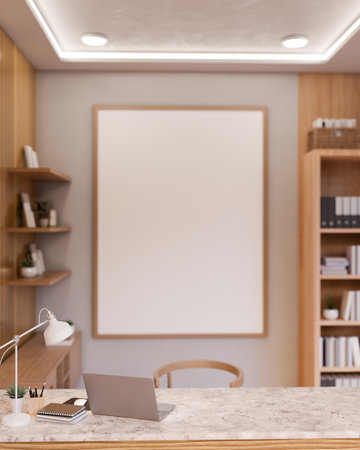The interior design of a luxurious minimalist office features a laptop on a luxury white marble table, a bookshelf, a frame mockup on a wall, and decor. 3d render, 3d illustrationの写真素材