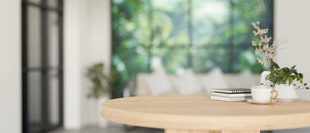 A close-up image of a space for display products on a minimalist round wooden table in a...