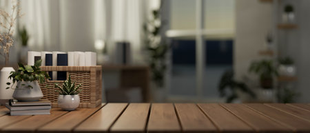 A wooden tabletop features a wicker basket fulled of books, potted plants, and a copy space against a blurred background of a minimalist apartment room. 3d render, 3d illustrationの写真素材