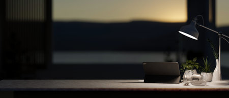 A modern dark office at night features a digital tablet, headphones, potted plants, and a dim light...