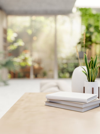 A close-up image of books and decorative plants on a wooden table in a contemporary bright living room with a beautiful garden on the back. 3d render, 3d illustrationの写真素材