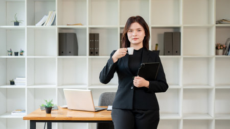 A portrait of a successful, beautiful Caucasian businesswoman or lawyer in a business black suit...