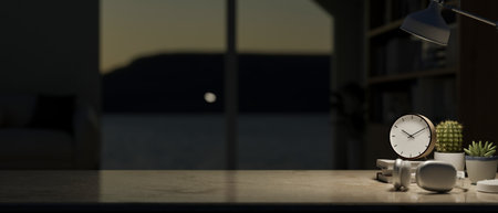 A close-up of a copy space on a tabletop with accessories and illuminated by a table lamp in a dark room at night. workspace at night, office desk, place of work, 3d render, 3d illustrationの写真素材
