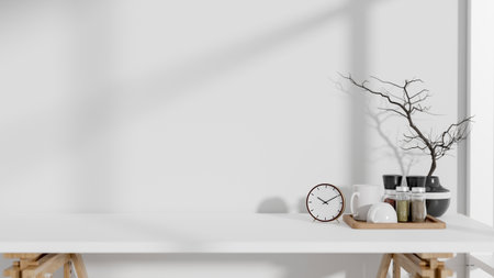 A front view of a copy space for displaying products on a minimalist white tabletop with decor against the white wall. 3d render, 3d illustrationの写真素材
