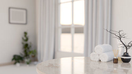 A close-up of a luxury white marble table features towels, a reed diffuser, and a minimal black ceramic vase in a luxury white room. bath accessories, spa, hygiene, 3d render, 3d illustrationの写真素材