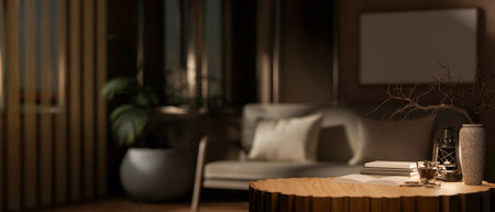 The round wooden table with decorative items in the middle of the room, with blurry background of...