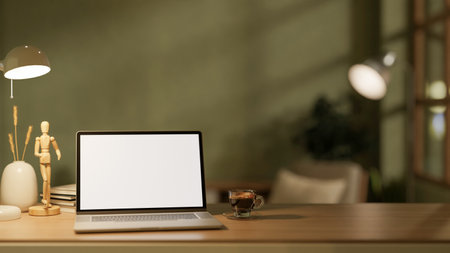 The white screen laptop and a coffee cup place on wooden table with decor in the dim light room. Study corner set up, 3D Rendering, 3D Illustration.の写真素材