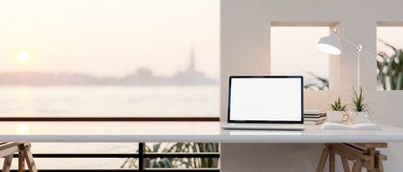 White screen laptop and coffee on white table under lamp light near a terrace with river view. Working or Study corner. 3D rendering, 3d illustration.の写真素材