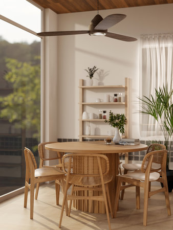 Set of wooden round table and chairs under a ceiling fan in a kitchen or dining room with glass wall and white painted. 3D rendering, 3d illustration.の写真素材