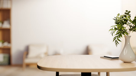 Plant vase with phone and books on wooden table across armchair and white wall of modern living...