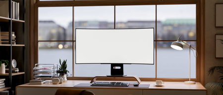Blank curved screen computer and coffee cup on wooden table in glass wall living room or office....