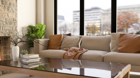 Books and vase on glass table and sofa couch aside fireplace and wall window in a house or...