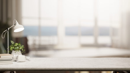 Lamp and books aside pot plant on marble counter table across glass wall window in bright living...