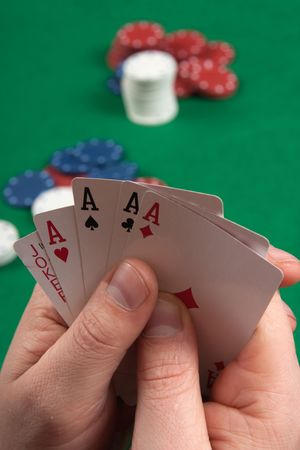 Poker gambler in black shirt close-up. Focus on the hand and  cards