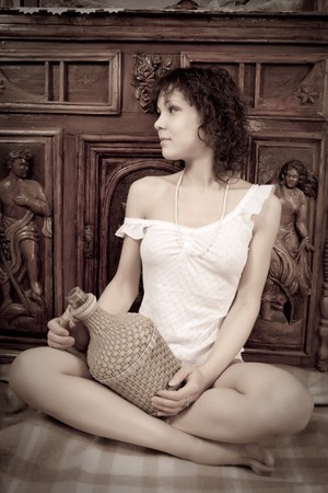 Fashion type photo of an stunningly beautiful young woman posing in vintage flat の写真素材
