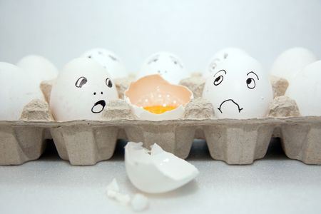 Eggs with smile on the white backgroundの写真素材