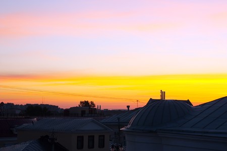 daybreak from town rooves . landscape in warm tonesの写真素材