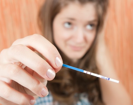 Teenage pretty Girl Shocked By Pregnancy Test
の写真素材
