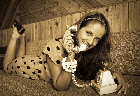 Fashion type photo of an stunningly beautiful young woman posing in vintage flat の写真素材