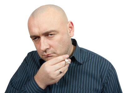 unsuccessful man with cigarette isolated on whiteの写真素材