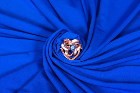 jewels on blue fabric as a backgroundの写真素材