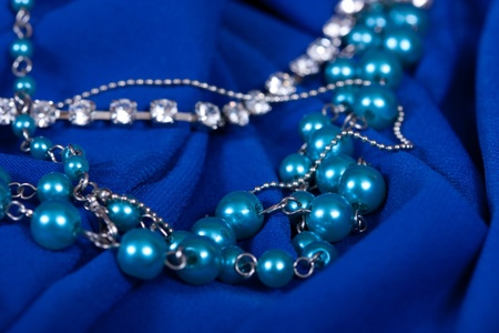   luxury background of jewels on blue fabric