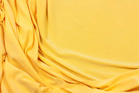 fabric in yellow in the backgroundの写真素材