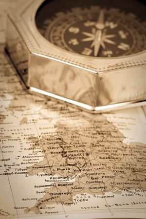 compass close-up on map . Focus on map
