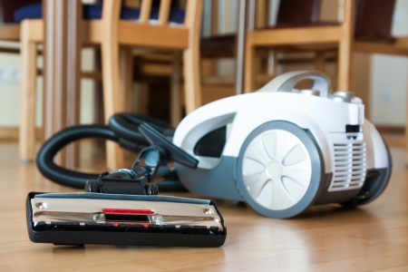 White vacuum cleaner on  parquet  close-upの写真素材
