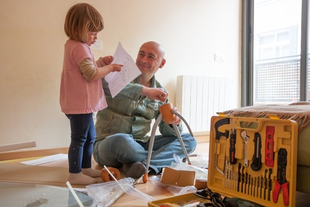 Dad and daughter renovating coffee tableの写真素材