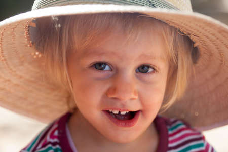Portrait of  cute girl in  straw hatの写真素材