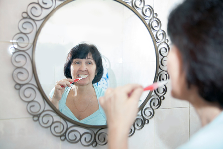 woman washes in   bath in   morning.の写真素材