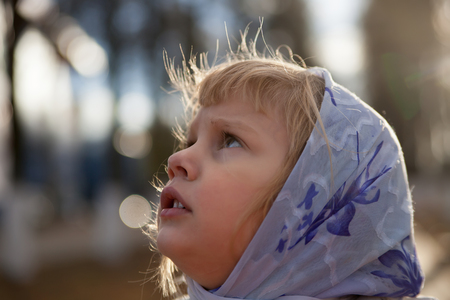 Little girl outdoors in autumn.の写真素材