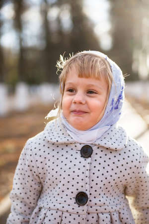 Portrait of   beautiful little girl wearing   headscarf on her head.の写真素材