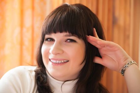 Portrait of smiling girl against   light.の写真素材
