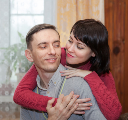 Portrait of  cute young couple at home.の写真素材