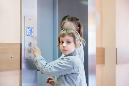 Two little sisters causing   lift in medical  clinic