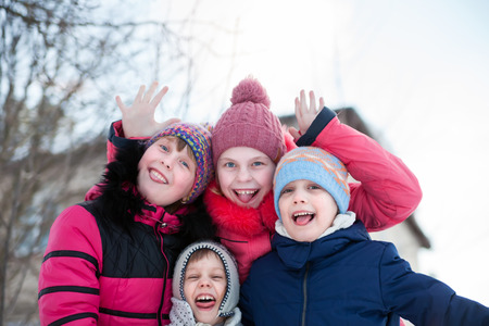 Children playing during winter day  の写真素材
