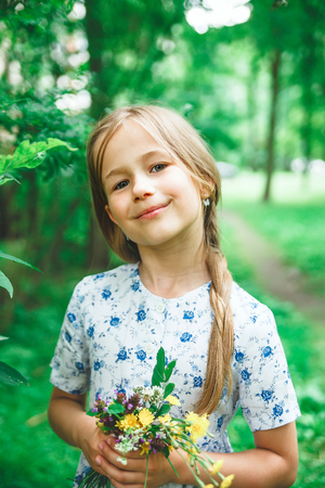 Portrait of   blond girl in   summer dayの写真素材