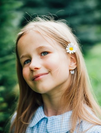 Portrait of   pretty girl 8 years on   street. の写真素材
