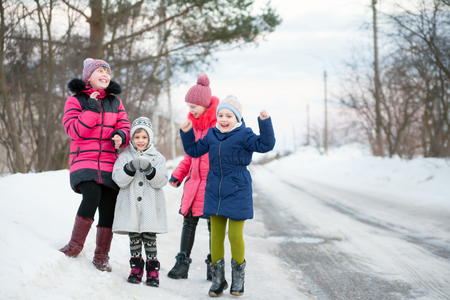 portrait of four joyful sisters on  street in   winter. の写真素材