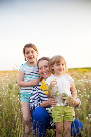 Portrait of   grandmother and two granddaughters of 4 and 6 years old.
の写真素材
